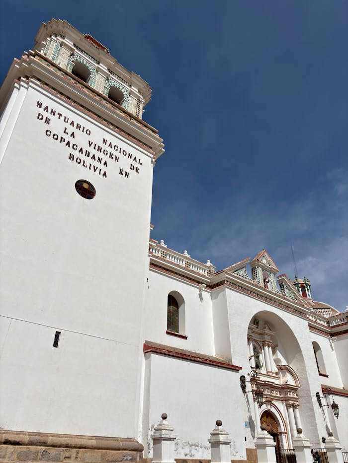 menu-02 An architectural view of the Basilica of Our Lady of Copacabana under a clear blue sky in Bolivia.