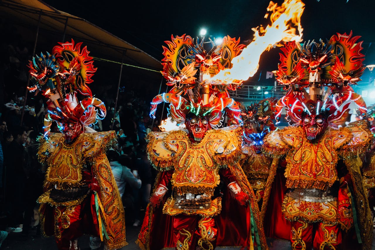 Vibrant Diablada dancers with fiery costumes at a nighttime festival in Bolivia.
